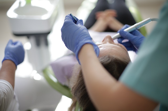 Emergency Dentist at Windsor checkup the patient at Roseland Family Dental